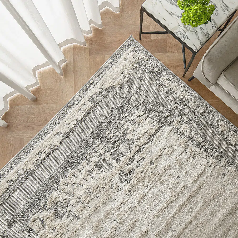 Close-up view of the Mist Haven Rug showcasing its distressed gray and cream design, ideal for modern and minimalist interiors.