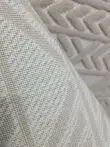 Back view of Selene rug with durable stitched mesh backing